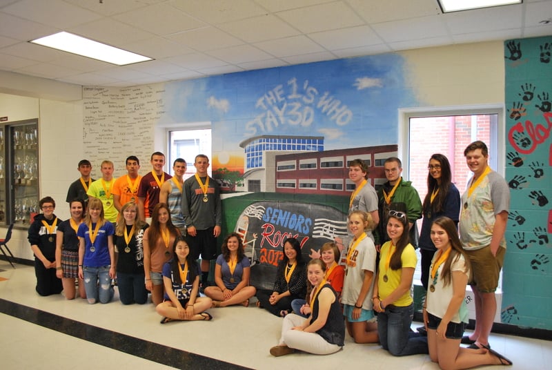 students posing with yellow ribbon medals students posing with yellow ribbon medals